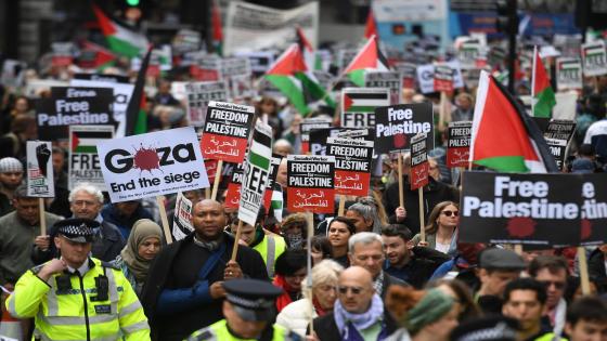 People hold up placards as a march calling for justice for Palestinians amid a growing threat of further war in the Middle East moves through the streets of central London on May 11, 2019. (Photo by Daniel LEAL-OLIVAS / AFP) (Photo credit should read DANIEL LEAL-OLIVAS/AFP/Getty Images)