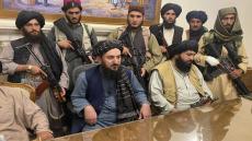 Taliban fighters take control of Afghan presidential palace after the Afghan President Ashraf Ghani fled the country, in Kabul, Afghanistan, Sunday, Aug. 15, 2021. (AP Photo/Zabi Karimi)